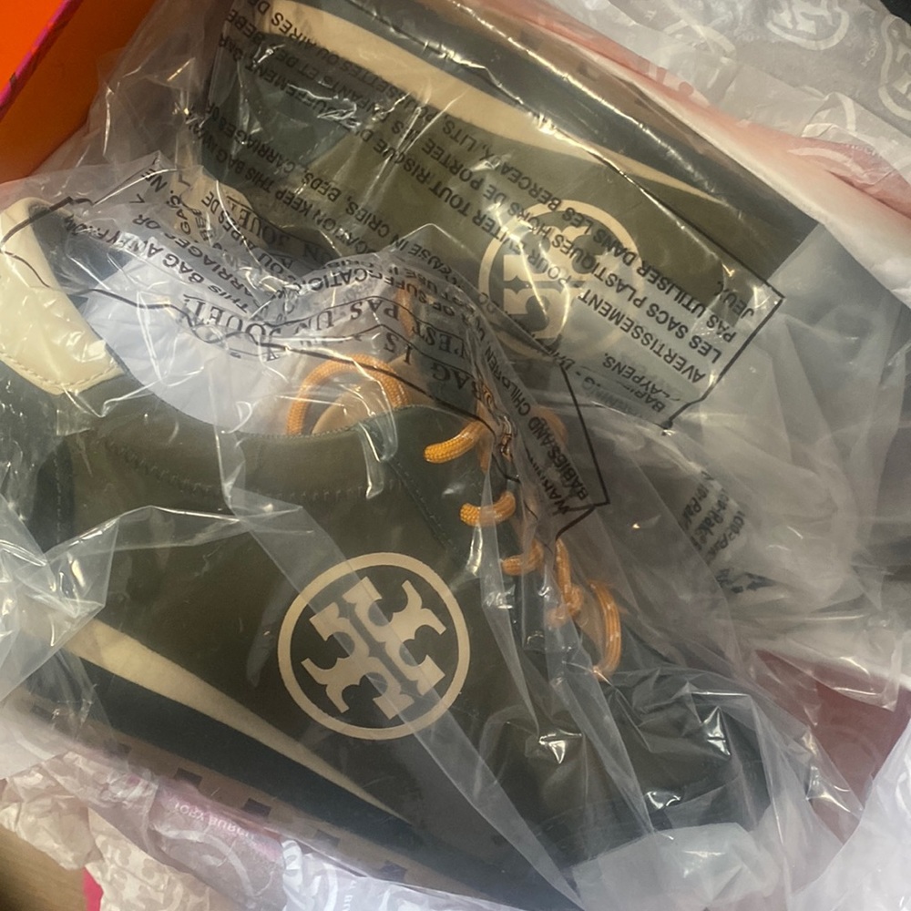 Tory Burch green sneakers.